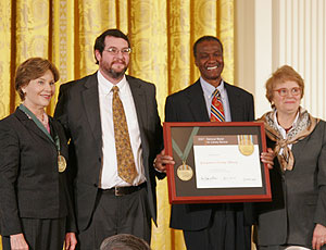 Left to right: Mrs. Laura Bush, community member George Geer, Board Chairman Virgil Grayson, and IMLS Director Anne Radice.