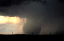 A microburst descends from the parent cloud to the ground