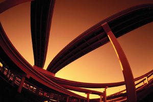 View from below of multiple overpasses in a highway interchange system.