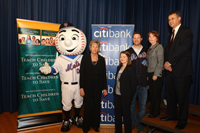 Deputy Comptroller of the Currency Barry Wides participates in Teach our Children to Save event in Queens, NY with Mr. Met; Karen Lutz, NY State Regional Manager, Citibank; Laura Fisher, ABA Education Foundation; Aaron Heilman, NY Mets Pitcher; Eileen Auld, NY Community Relations, Citi. 