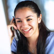 Image of smiling woman on telephone.