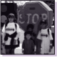 Children holding a stop sign