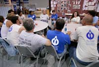 President George W. Bush meets with volunteers from Hands On Network at their base camp in Biloxi, Mississippi, Thursday, April 27, 2006.