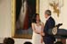 President George W. Bush congratulates Angela An of Washington, D.C., on presenting her the President’s Volunteer Service Award Thursday, May 10, 2007, in the East Room of the White House, in celebration of Asian Pacific American Heritage Month.  On October 23, 1992, President George H.W. Bush signed Public Law 102-450, designating May as Asian Pacific American Heritage Month.  President George W. Bush has celebrated this occasion every year since 2001, when he signed the proclamation for Asian Pacific American Heritage Month.