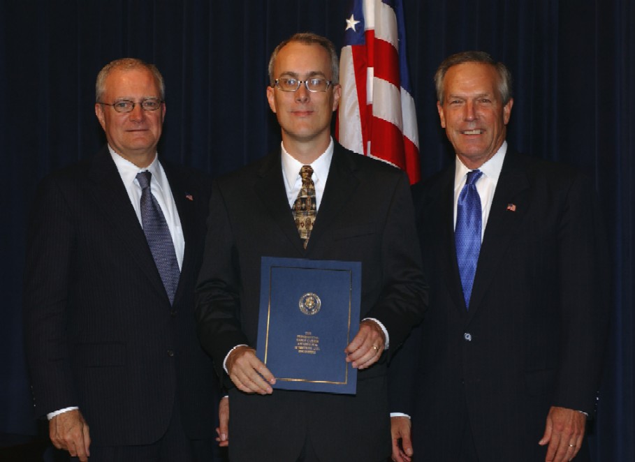 Photo of Jon R. Pratt receiving the 2003 Presidential Early Career Awards for Scientists and Engineers.