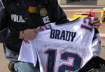 ICE Enforcers examine football jersey.