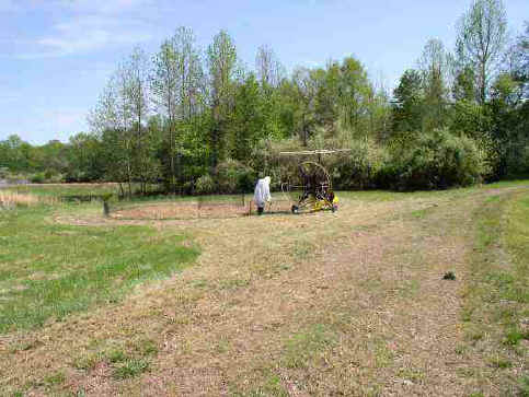 This distance shot gives some of the scale of the chick's training area. Walking out to the circle pen and following the trike is good exercise for the developing chick.  Photo, Kathleen O'Malley, USGS 