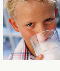 a boy drinking milk