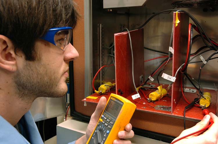 P. Prezas checks the voltages of A123Systems' lithium-ion batteries