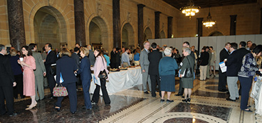 Attendees of the ITA Alumni Reunion arrive in the lobby of the Department of Commerce on May 12, 2008.
