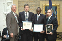 Special Recognition.  Secretary Ed Schafer presents a Special Recognition Award to NRCS Chief Arlen Lancaster and Certificates of Appreciation to Herby Bloodworth and Melvin Westbrook for the work done by NRCS employees in Afghanistan and Iraq