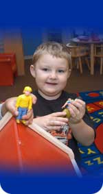 Photo of a boy holding an action figure
