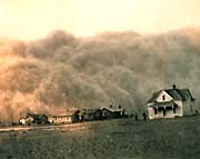 A huge dust stom moves across the prairie.