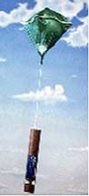 A dropwindsonde drifts downward after deployment from hurricane aircraft