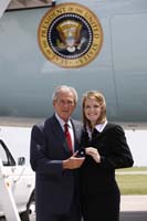 President George W. Bush presented the President’s Volunteer Service Award to Ashley Knight upon arrival in Olathe, Kansas, on Thursday, May 29, 2008.  Knight, 25, is a volunteer with Students Take Action and YouthFriends.  To thank them for making a difference in the lives of others, President Bush honors a local volunteer when he travels throughout the United States.  He has met with more than 600 volunteers, like Knight, since March 2002.