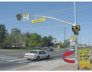 The city of Tucson developed HAWK signals, such as the one shown here, specifically to aid pedestrians at crosswalks. An RSA recommended changes to the device and roadway environment around it that improved safety for pedestrians even more.