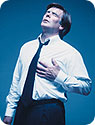 A man grabbing his chest in pain.