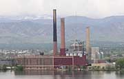 An energy factory complex with smoke stacks 
