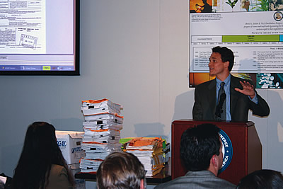Photo showing Under Secretary Dudas demonstrateing the Public PAIR system at a ceremony celebrating IFW, and access to IFW through public PAIR.