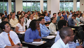 Photo showing newly hired patent examiners attending the new USPTO Patent Training Academy, a university-style approach to teaching USPTO's new examiners. More than 1,200 new patent examiners began their careers at the USPTO in fiscal year 2006 with this training program.