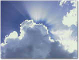 photo of sun shining through clouds