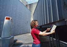 NIST led a multiagency effort to develop new standards for radiation detectors and monitors. Here, a hand-held device is used to check the cargo of a truck trailer.