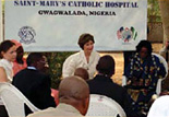 First Lady Laura Bush speaks with families living with and affected by HIV/AIDS during her visit to St. Mary's Catholic Hospital, Gwagwalada.