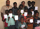Children show off their new birth certificates.