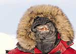 Jody Deming hides behind the fur-lined hood of her insulated parka.