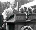 Ike at the speaker's podium, with the flatirons in the background