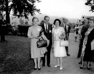 Lady Bird Johnson was instrumental in making aesthetically pleasing views from the road an important goal of the Interstate System. In May 1965 she embarked on a "Landscape-Landmark Tour" in northern Virginia, taking I-95 and parallel U.S. 1 to compare the two highways. At the White House, Mrs. Johnson posed with Federal Highway Administrator Rex Whitton and his wife, Callie Maud, who brought homemade cookies to share with participants on the bus ride.