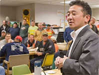 Photo: man talking in group