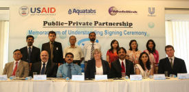 USAID signed three Memorandums of Understanding with corporate sector firms Mobilink, Medentech, and Unilever Pakistan Ltd.  Photo shows (left to right seated) Mr. Javed Ali Khan, Director General, Ministry of Environment, Sigurd Hanson, Chief of Party, Pakistan Safe Drinking Water and Health Promotion Project, Dr. Qadeer Ahsan, Program Management Specialist (Health), USAID Pakistan, Katheen MacDonald, Office Director, Health & Democracy and Governance, USAID Pakistan, Amar Naseer, Company Secretary & Legal Director, Unilever Pakistan, Sadia Anwer, Director Operations & CSR, Mobilink, and Michael Gately, Marketing Director Asia, Aquatabs. Click for larger photo.