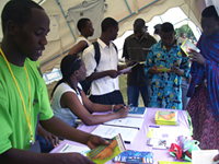 Young people get copies of ‘Faraja,’ a book about reproductive health and HIV written by a member of UJANA’s Youth Executive Committee.  The Kiswahili book was written by and for young people in Tanzania.