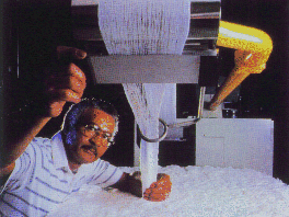 Photo of Eastman Chemical employee working on a machine.