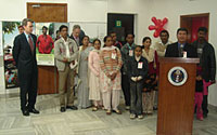 A photo exhibition of people living healthy and transformed lives after undergoing HIV/AIDS treatment was inaugurated at The American Center in New Delhi, India to observe World AIDS Day on December 1, 2006. The exhibition, the first of its kind in India, is entitled 'Photos of Hope: Lives Saved and Transformed.' U.S. Embassy Deputy Chief of Mission Geoffrey Pyatt and some of the portrait subjects listen as Dr. Chinkholal Thangsing, Asia Pacific Bureau Chief for AIDS Healthcare Foundation, speaks at the launch of the exhibit.