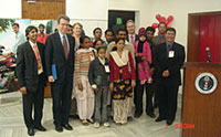 A photo exhibition of people living healthy and transformed lives after undergoing HIV/AIDS treatment was inaugurated at The American Center in New Delhi, India to observe World AIDS Day on December 1, 2006. The exhibition, the first of its kind in India, is entitled 'Photos of Hope: Lives Saved and Transformed.' U.S. Embassy Deputy Chief of Mission Geoffrey Pyatt and Chinkholal Thangsing, Asia Pacific Bureau Chief for AIDS Healthcare Foundation, are pictured with some of the portrait subjects.