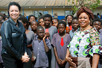U.S. Ambassador Carmen Martinez and First Lady Maureen Mwanawasa are pictured with students from the Chawama Basic School where the HIV/AIDS prevention campaign, “Real Man, Real Woman,” was launched. Photo by Zambia In-Country Team