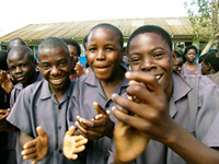 Students from the Chawama Basic School are pictured at the launch of the HIV/AIDS prevention campaign, “Real Man, Real Woman”. Photo by Zambia In-Country Team