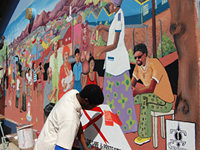 In August 2007, students from the Mandume Primary School in Katutura, the former Apartheid township of Windhoek, Namibia, collaborated with senior art students from the John Muafangejo Art Center in Katutura and local artists to create murals about HIV/AIDS at the school. Photo by Namibia PEPFAR team