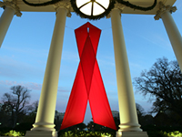 A red ribbon adorns the North Portico of the White House Friday, November 30, 2007, in recognition of World AIDS Day and the commitment by President George W. Bush and his administration to fighting and preventing HIV/AIDS in America and the world. White House photo by Eric Draper