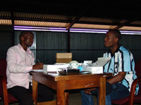 Zebras player Khumo ‘Shoes’ Motlhabane is the first to receive an HIV test at the Zebras 4 Life, Test 4 Life campaign in the village of Pandamatenga on April 18, 2007. The testing was done by a voluntary HIV/AIDS counseling and testing (VCT) center who set up tables in a grain storage shed in this farming community in northern Botswana.