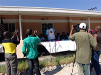 Onalethatha Tshekiso, a Zebras striker, speaks in front of cameras at the Kachikau event.