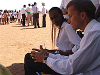 Ambassador Dybul interacts with a health reporter from The Mmegi, a local Batswana newspaper.