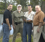 from left Miami-Dade County Department of Resources Management Floodplains Construction Inspector Julio Nores, NRCS Florida State Conservation Engineer Jesse Wilson, Miami-Dade County Project Manager Francisco Guarin, NRCS Florida Civil Engineer Elwyn Cooper (NRCS photo)