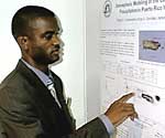 Conference participant, Dale Rankine from the Meteorological Service, Jamaica, commenting on a workshop poster.