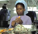 Crab pickers, like this young girl hard at work, face an uncertain future. 