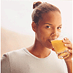 photo of girl drinking orange juice