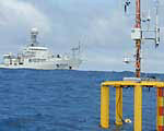 Deployment of experimental equipment to measure air-sea gas exchange in the Equatorial Pacific.
