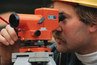 Man looking through a surveyer instrument